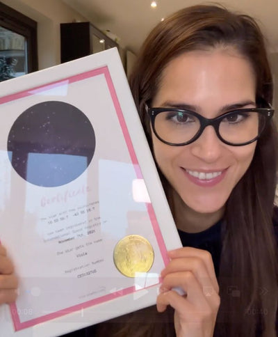 Woman presenting her star naming gift